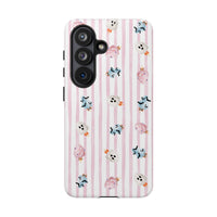 A protective phone case with a light pink and white vertical stripe pattern, decorated with small Halloween-themed cotton candy in pink, blue, and white, shown on a plain white background. sparkle paperie house