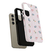 A protective phone case with a light pink and white vertical stripe pattern, decorated with small Halloween-themed cotton candy in pink, blue, and white, shown on a plain white background. sparkle paperie house