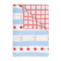 patriotic preppy blanket with red stars, blue stripes, and red bows. Two sided blanket 40x30 with red gingham, sparkle paperie house