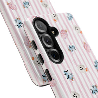 A protective phone case with a light pink and white vertical stripe pattern, decorated with small Halloween-themed cotton candy in pink, blue, and white, shown on a plain white background. sparkle paperie house